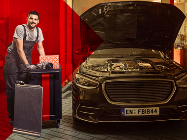 Mechanic in workshop with Air Conditioning products