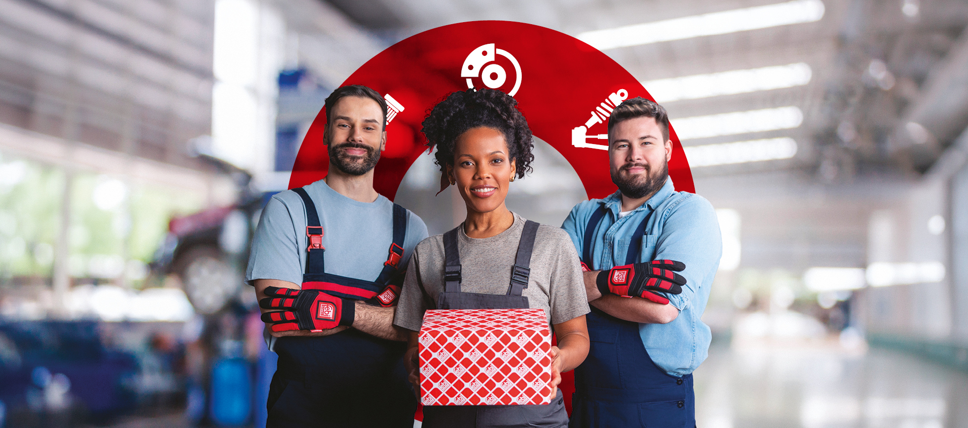 Three mechanics in a workshop one holding a febi box